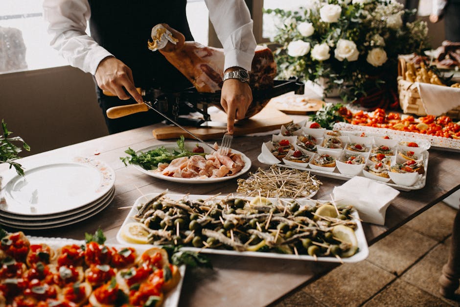 Colorful party appetizer spread with various finger foods and dips.