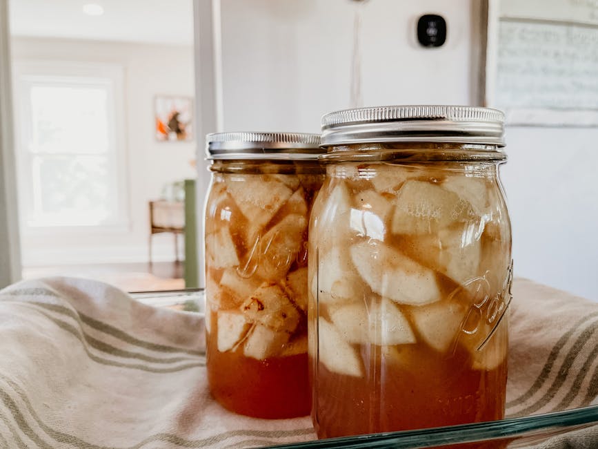 Mason jars filled with colorful preserved foods and jams.