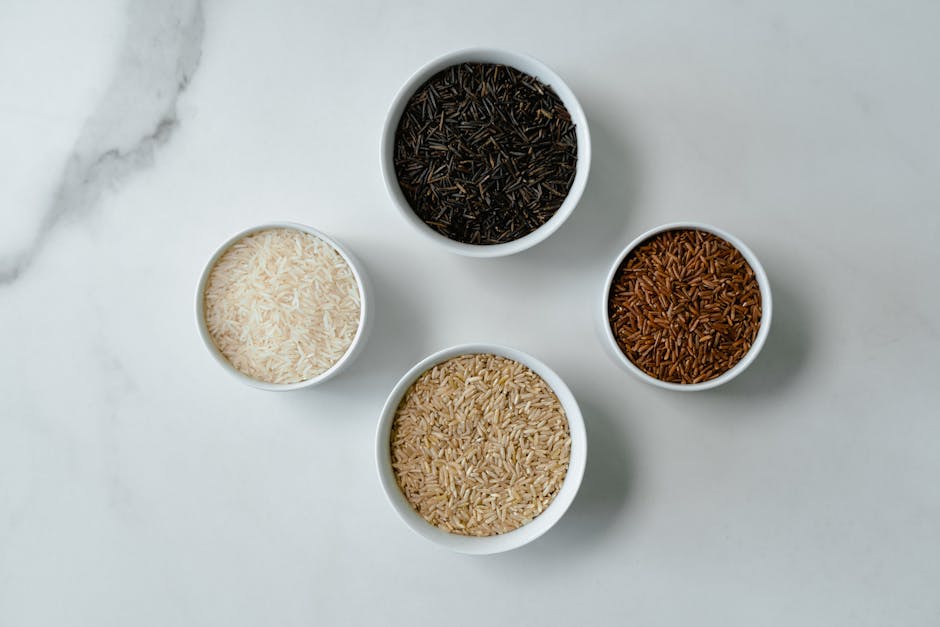 Bowls filled with colorful gluten-free grains and vegetables.