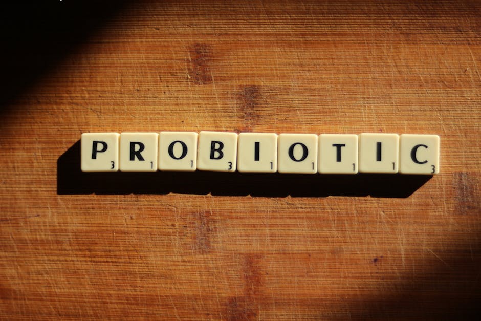 Probiotic-rich foods including yogurt, kimchi, and fiber-rich vegetables.
