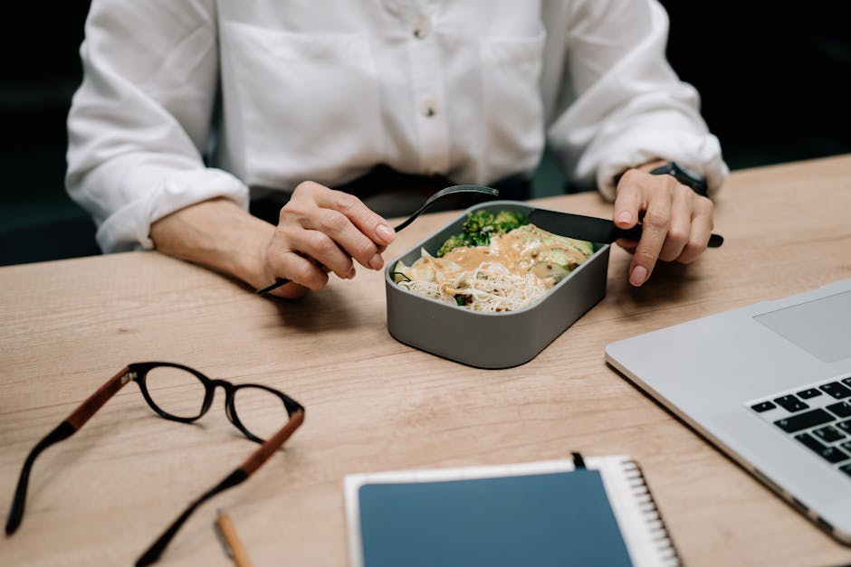 Reusable containers filled with colorful office-friendly lunches.