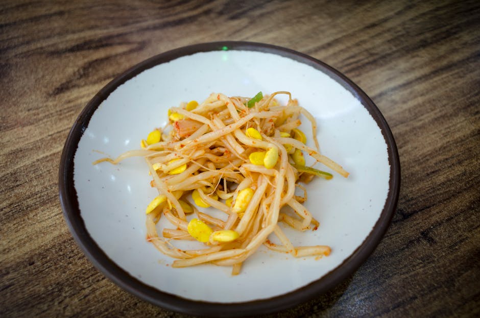 Assorted Korean banchan side dishes in small bowls on a table.