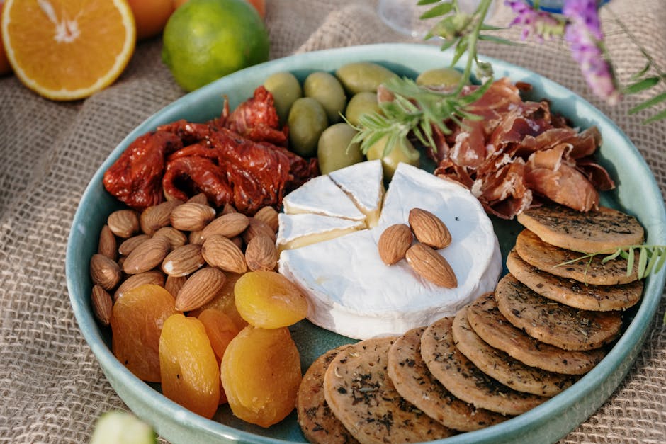 Mediterranean dishes including salads, dips, and grilled seafood on a table.