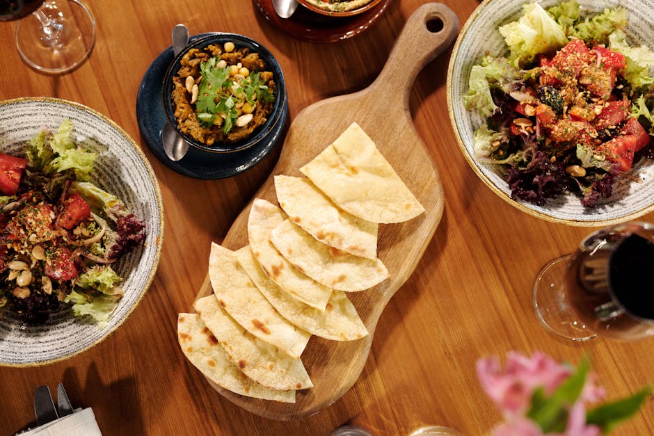 Middle Eastern mezze platter with hummus, falafel, and fresh vegetables.