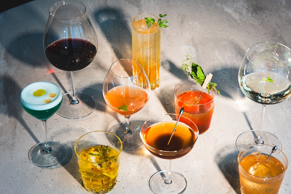 Colorful mocktails with fresh fruit garnishes and herbs.