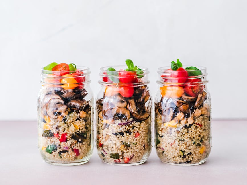 Mason jars filled with various homemade salad dressings.